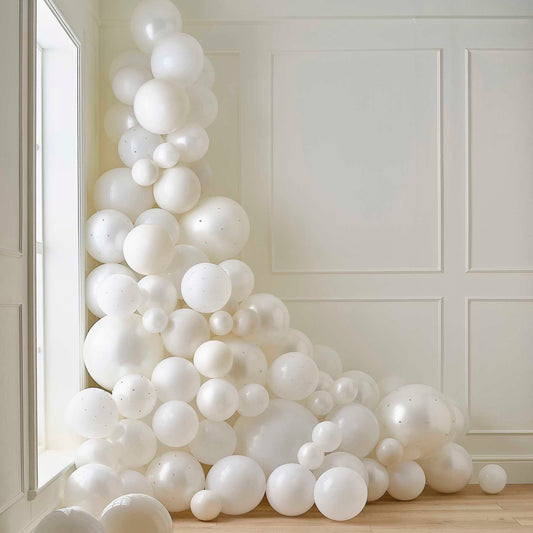 white and cream balloon arch with pearls elegant party decoration