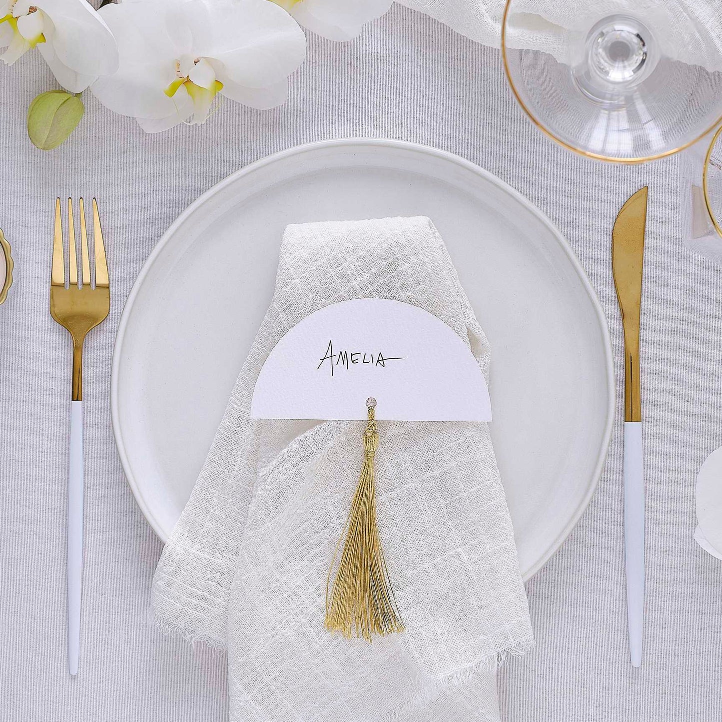 white wedding place cards with gold tassels elegant table décor