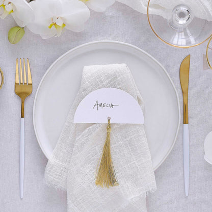 white wedding place cards with gold tassels elegant table décor