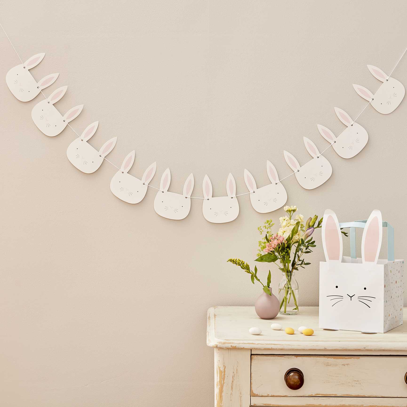 pink and white Easter bunny face bunting hanging for holiday party décor