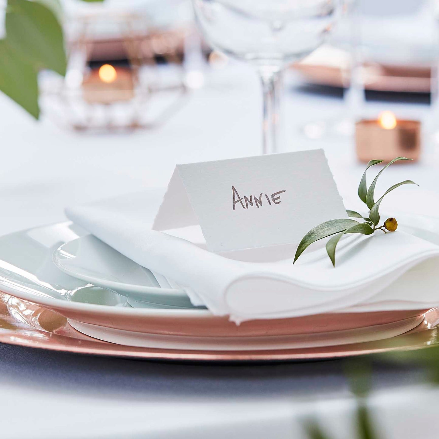 Elegant white place cards for wedding table settings