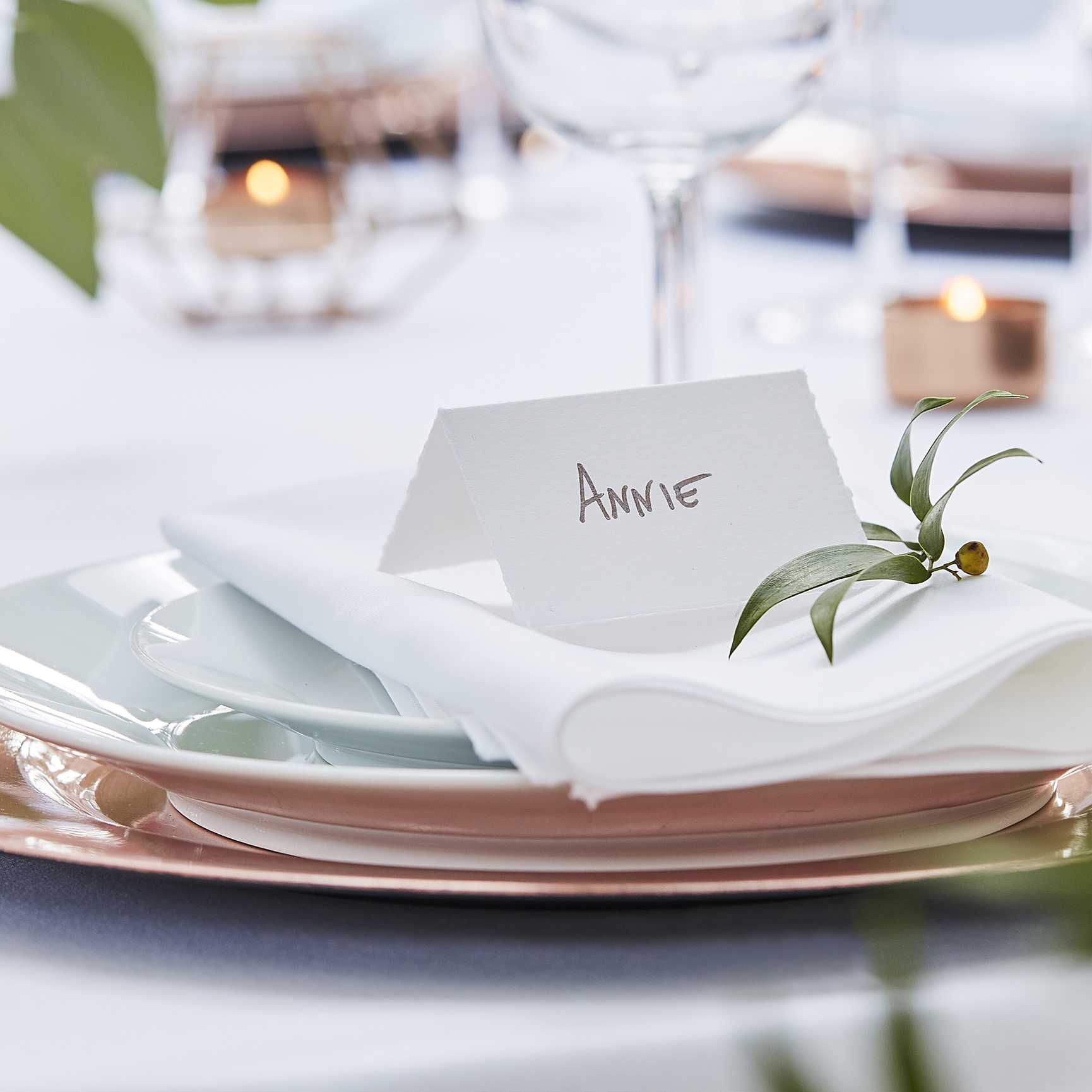 Elegant white place cards for wedding table settings