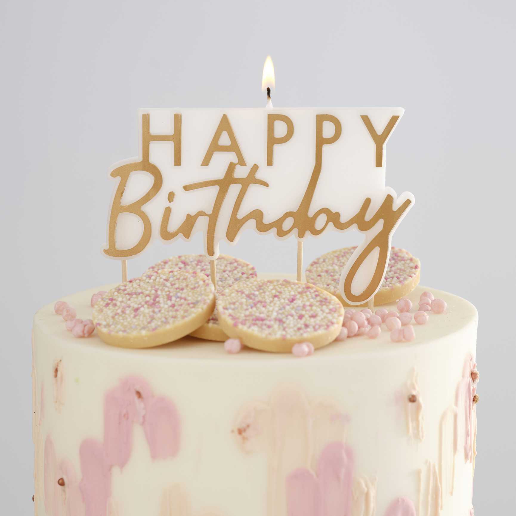 gold and white happy birthday cake candle