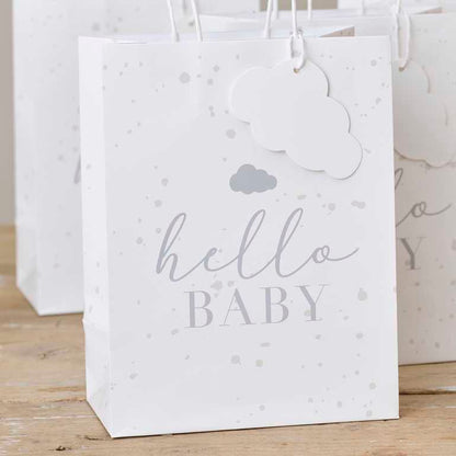 Neutral baby shower gift bags speckled paper bags with cloud tag