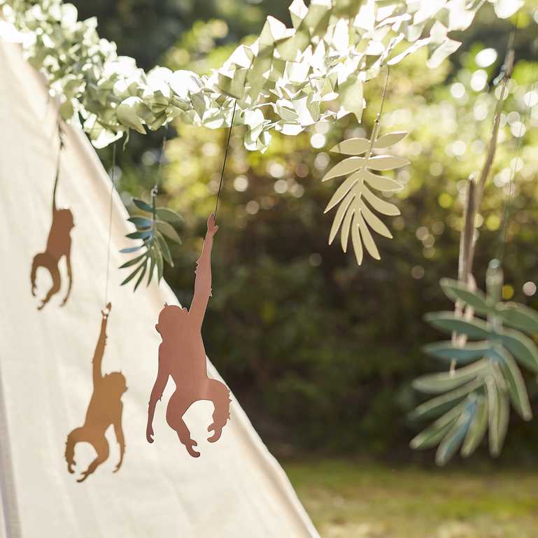 Jungle themed party backdrop with monkeys and leaves for birthdays