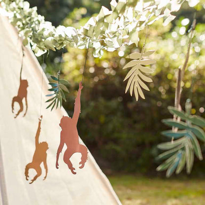 Jungle themed party backdrop with monkeys and leaves for birthdays